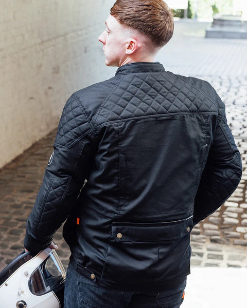 Merlin Edale II Waxed D3O Jacket - Black worn by model outdoors
