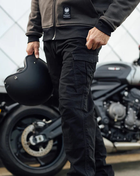 Merlin Remy 2 Riding Cargo Pants - Black worn by model outdoors with motorcycle